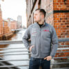 1-Sweatjacke-grau-StadtLand-Rot-Vorne.jpg